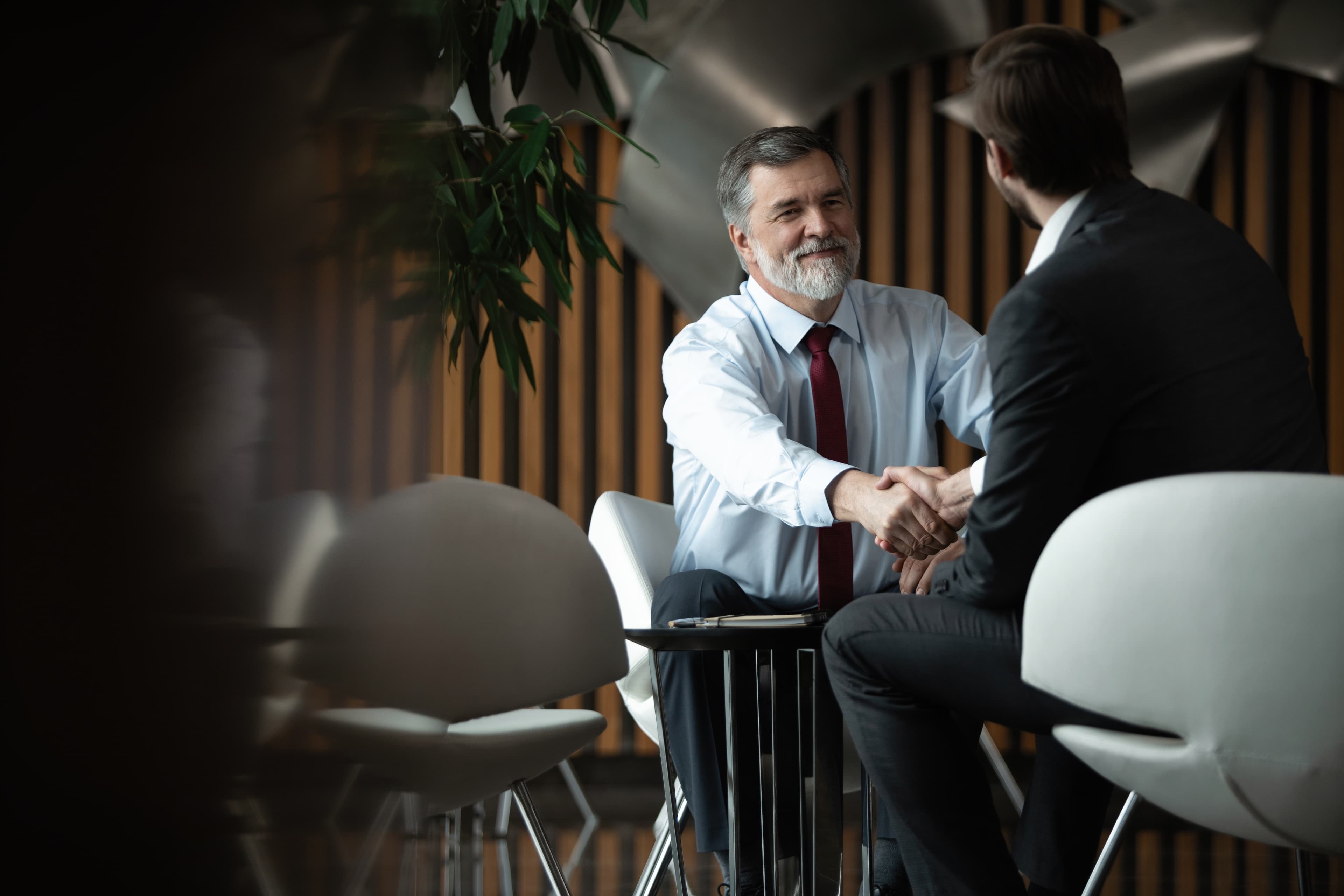 Business man shaking hands with client